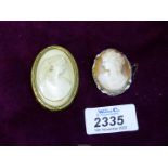 Two Cameo brooches.