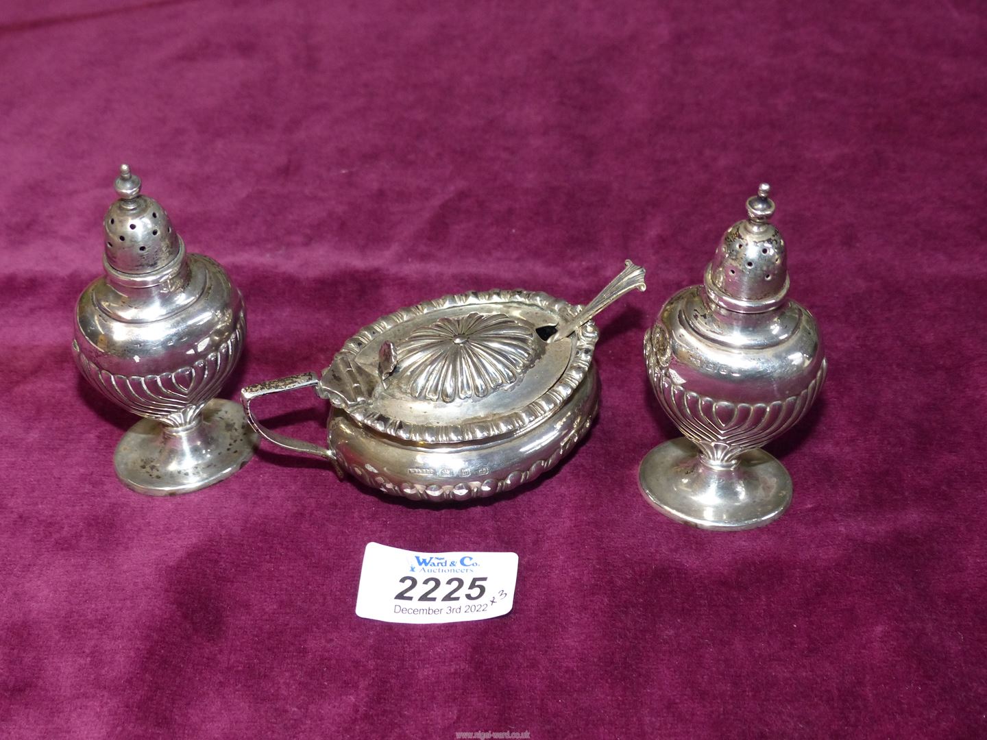 A pair of Silver salt and pepper Pots and matched mustard Pot with blue glass liner and spoon,
