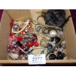 A quantity of costume jewellery including beads, brooch etc.