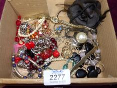 A quantity of costume jewellery including beads, brooch etc.