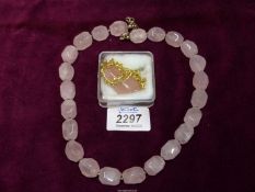 A rose quartz necklace with 925 silver clasp and one other with yellow metal chain.