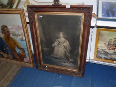 A print of Queen Victoria in carved wood frame with crown finial, 26'' x 34 1/2''.