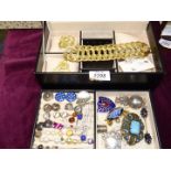 A black jewellery box and contents of mixed silver and pearl earrings, brooches hat pins,