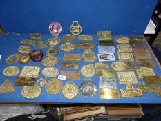 A quantity of brass Rally plaques.
