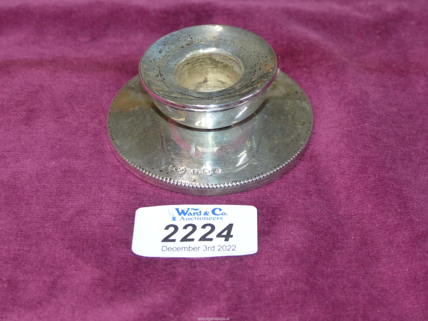 A small Silver weighted candle holder, Birmingham 1933, maker M & J.