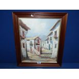 A framed oil on canvas of a mountain village scene, indistinctly signed lower right.