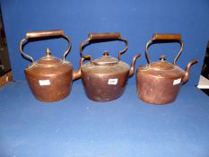 Three copper kettles, one marked G. H & C to base.