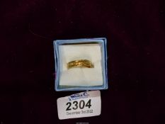 A 22ct gold wedding band with engraved detail, engraved inside '1909', makers S&W, size L 1/2.