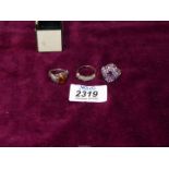 Three dress rings including pink stone, Amber and silver ring set with multiple stones.