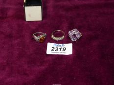 Three dress rings including pink stone, Amber and silver ring set with multiple stones.