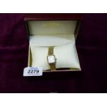 A ladies Rotary gold plated watch with a 7" strap in original box,