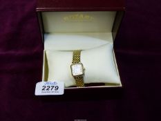 A ladies Rotary gold plated watch with a 7" strap in original box,