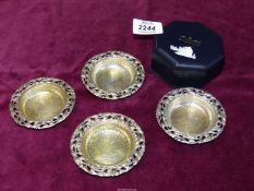 Four small butter/bonbon dishes having floral filigree design edging, 800 Continental silver.