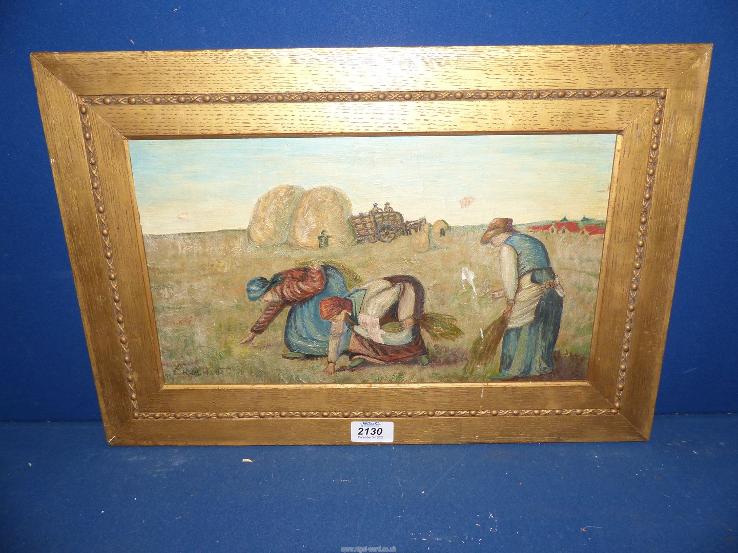 A gilt framed Oil on board of Gleaners in a field by E.