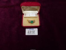 A continental 14k gold emerald and diamond ring,