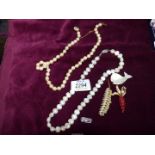 A Natural Pearl necklace with silver clasp marked 925 and one other with yellow metal clasp,