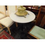 A marble top pedestal table,