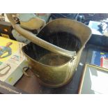 A brass coal scuttle