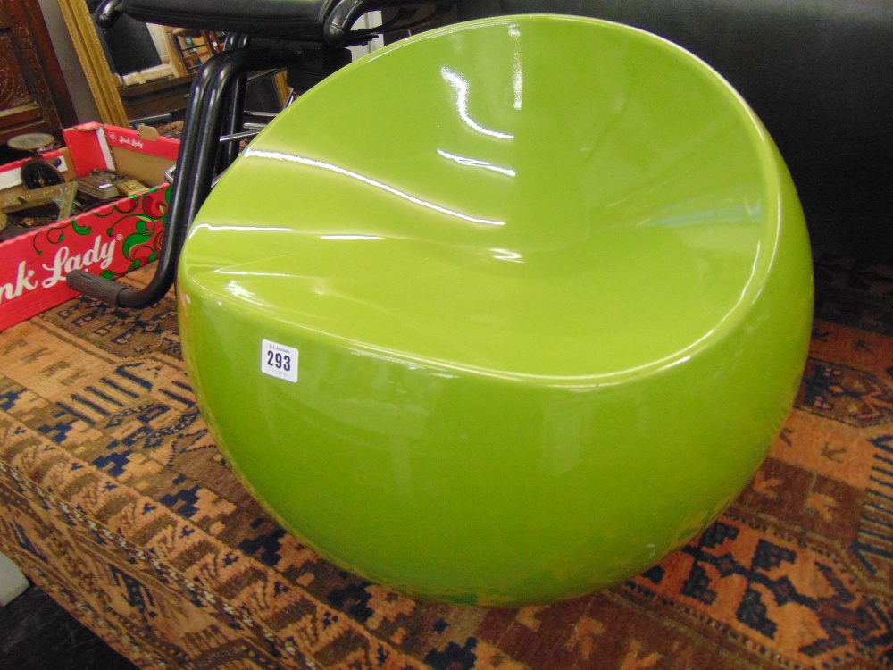 A retro green ball chair,