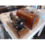 A singer hand sewing machine,