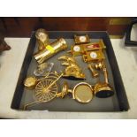 A collection of brass miniature clocks