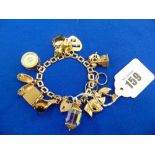 An early 1960's charm bracelet in 9ct Gold total weight 58 grams