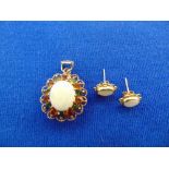 An unmarked Gold, earrings and pendant, set with Opals,