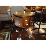 A revolving leather top bookcase