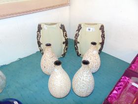 A pair of vases and a set of four vases