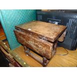 A small antique drop leaf table