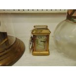 A miniature carriage clock,