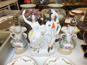 Two figural lamps and a Staffordshire flat back