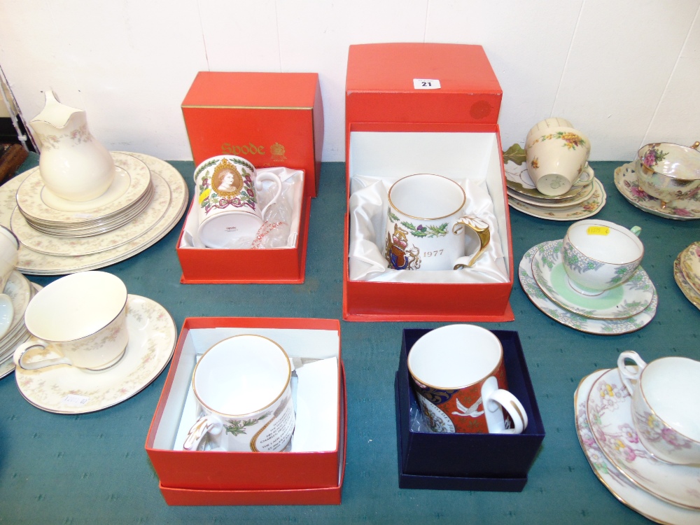 Three Spode Royal commemorative boxed mugs and a Royal Worcester mug