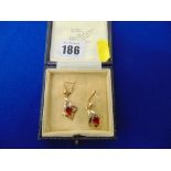 A pair of 18ct gold earrings,