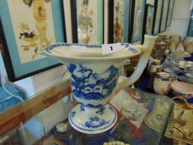 An antique Chinese Qianlong, blue and white, helmet shaped cream jug,