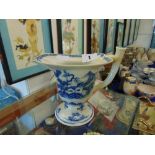 An antique Chinese Qianlong, blue and white, helmet shaped cream jug,