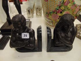 A pair of bronze and marble bookends