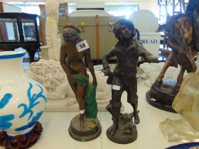 A bronze lady figure and a bronze figure of a young boy