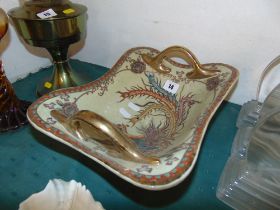 A decorative porcelain two handled dish