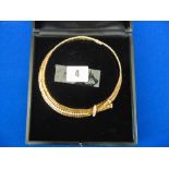A Kutchinsky 18ct gold and diamond necklace, 1960/70's, woven strap with bow motif,