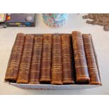 A set of eight leather bound encyclopedias