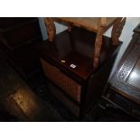 A Mahogany and rattan two drawer cabinet