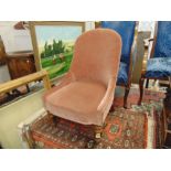 A pink upholstered nursing chair