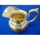 A hallmarked silver water jug, total weight 509 grams,