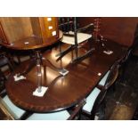 A Regency style dining room suite; table with extra leaf,