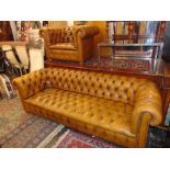 A Chesterfield three seater leather sofa and chair,