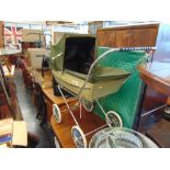 A vintage Silver cross dolls pram