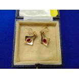 A pair of 18ct gold earrings,