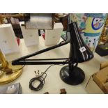 A black angle poise lamp