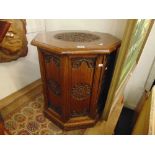 A carved eastern Teak octagonal cabinet a.